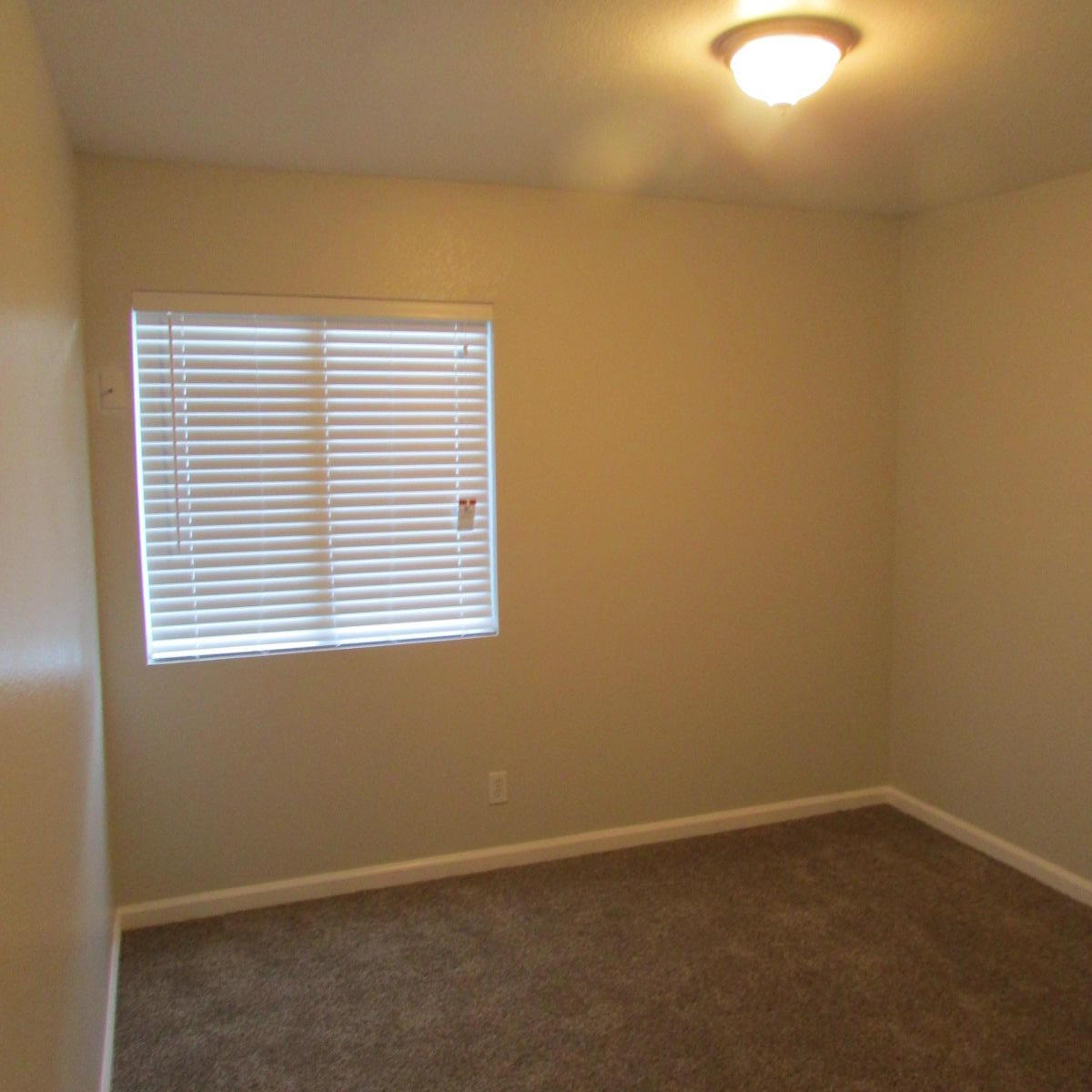 1832 Ivory Avenue Palmdale, CA 93550 - Photo 35 of 52 an empty room with a window