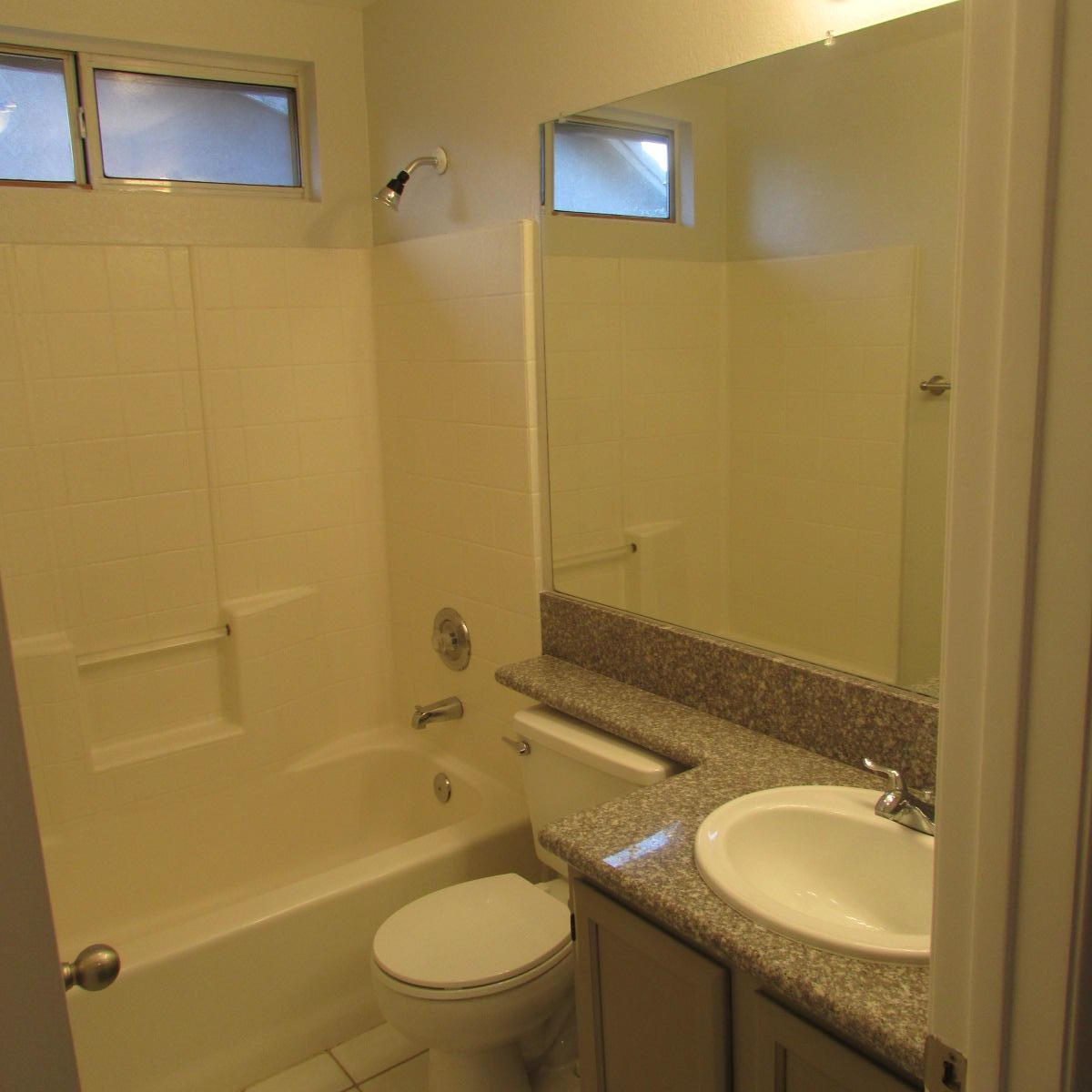 1832 Ivory Avenue Palmdale, CA 93550 - Photo 41 of 52 a bathroom with a granite countertop sink toilet and shower