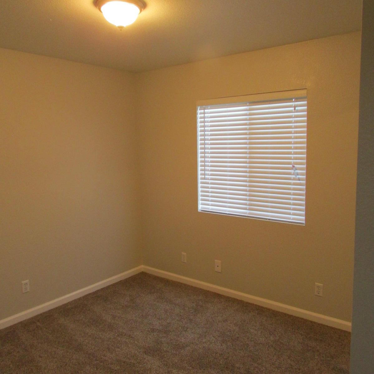 1832 Ivory Avenue Palmdale, CA 93550 - Photo 42 of 52 an empty room with a window