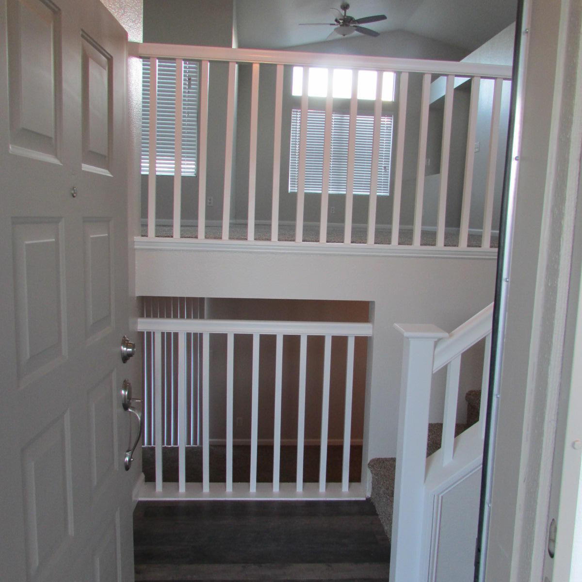 1832 Ivory Avenue Palmdale, CA 93550 - Photo 10 of 52 a view of staircase with railing and a window