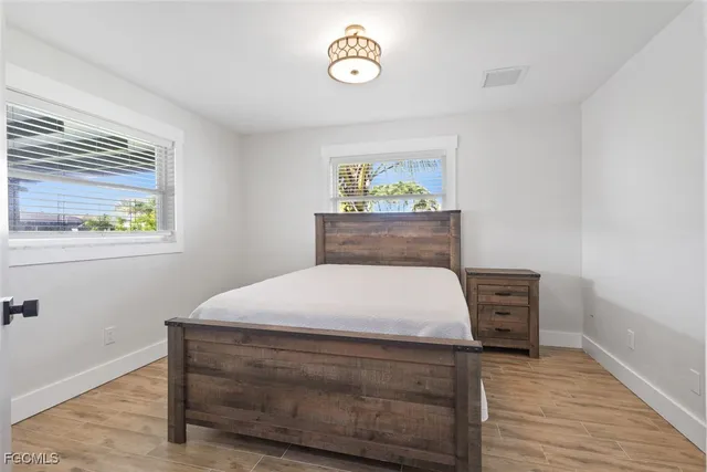 a room with a bed and a window