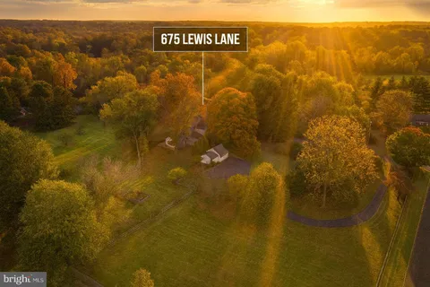 a kitchen with counter top space and wooden floor