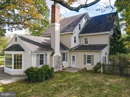 a view of a backyard with swimming pool