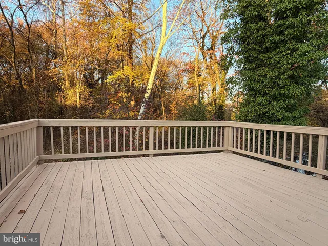 a view of deck with wooden floor and fence