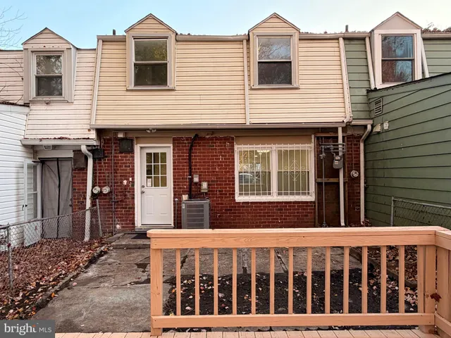 a view of a brick house with large windows