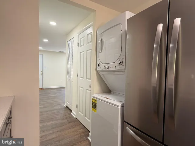 a room with refrigerator and washer