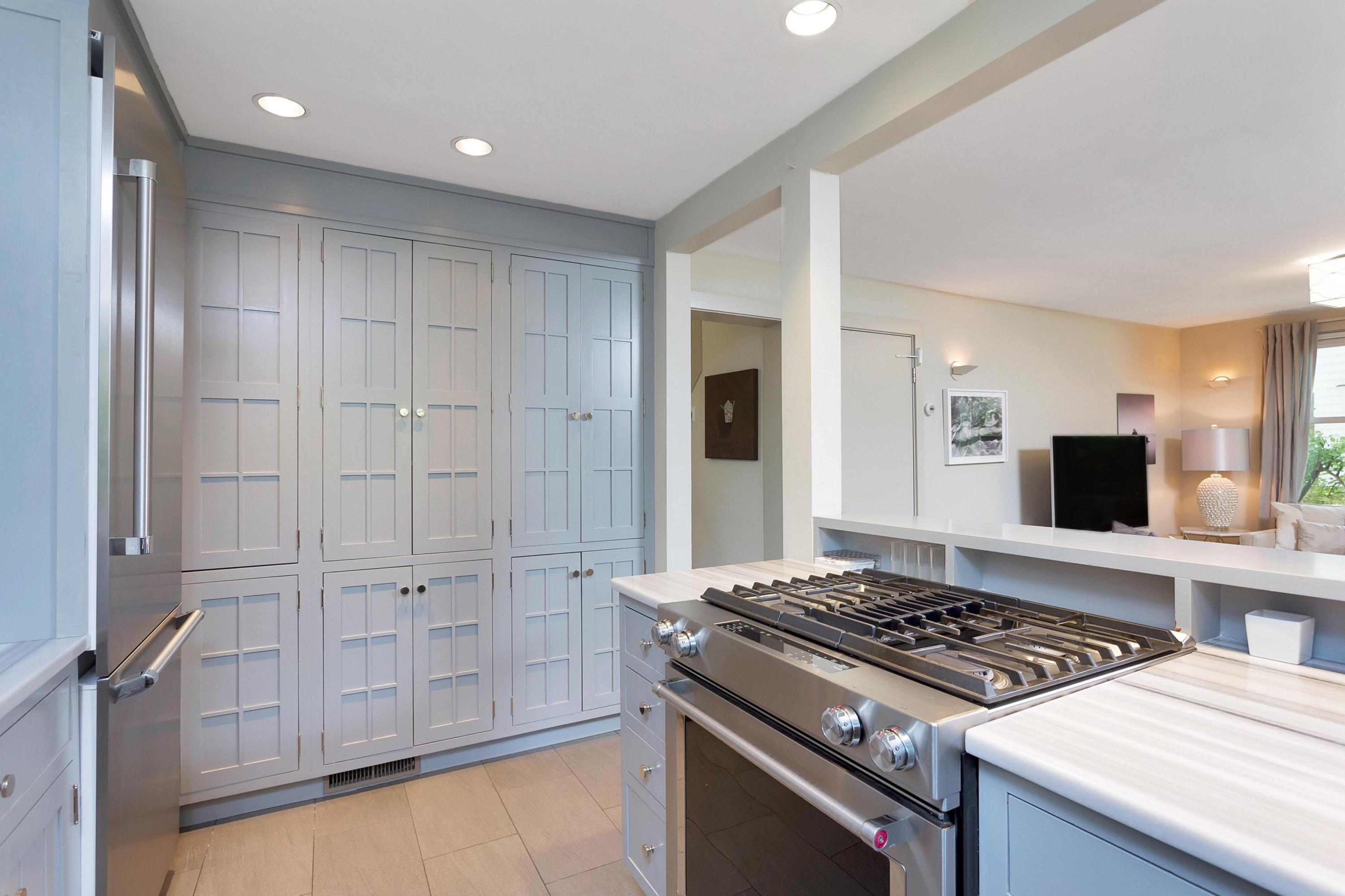 12 Crest Road Rowayton, CT 06853 - Photo 14 of 35 a kitchen with white cabinets and appliances