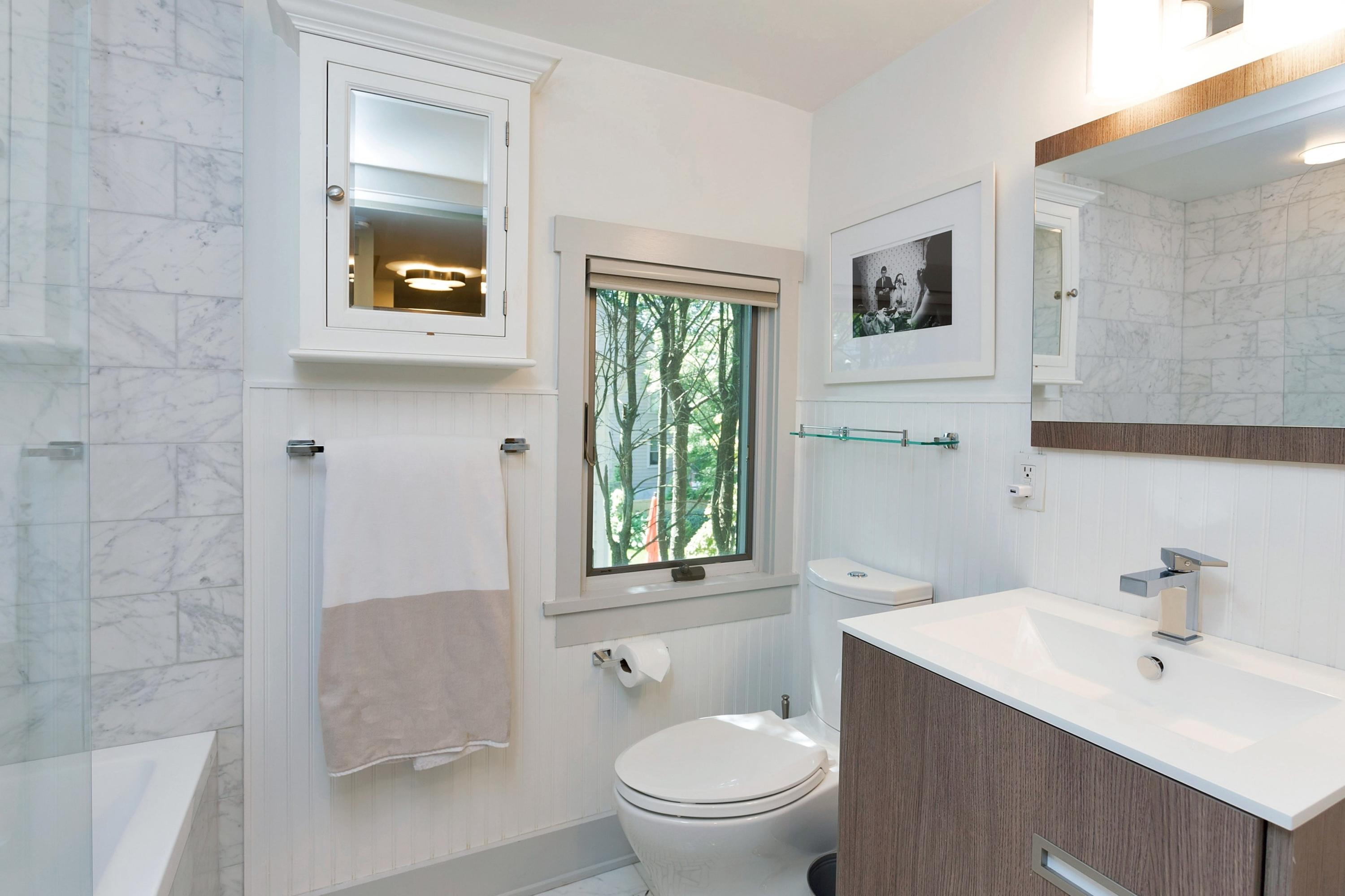 12 Crest Road Rowayton, CT 06853 - Photo 20 of 35 a bathroom with a toilet a sink and mirror