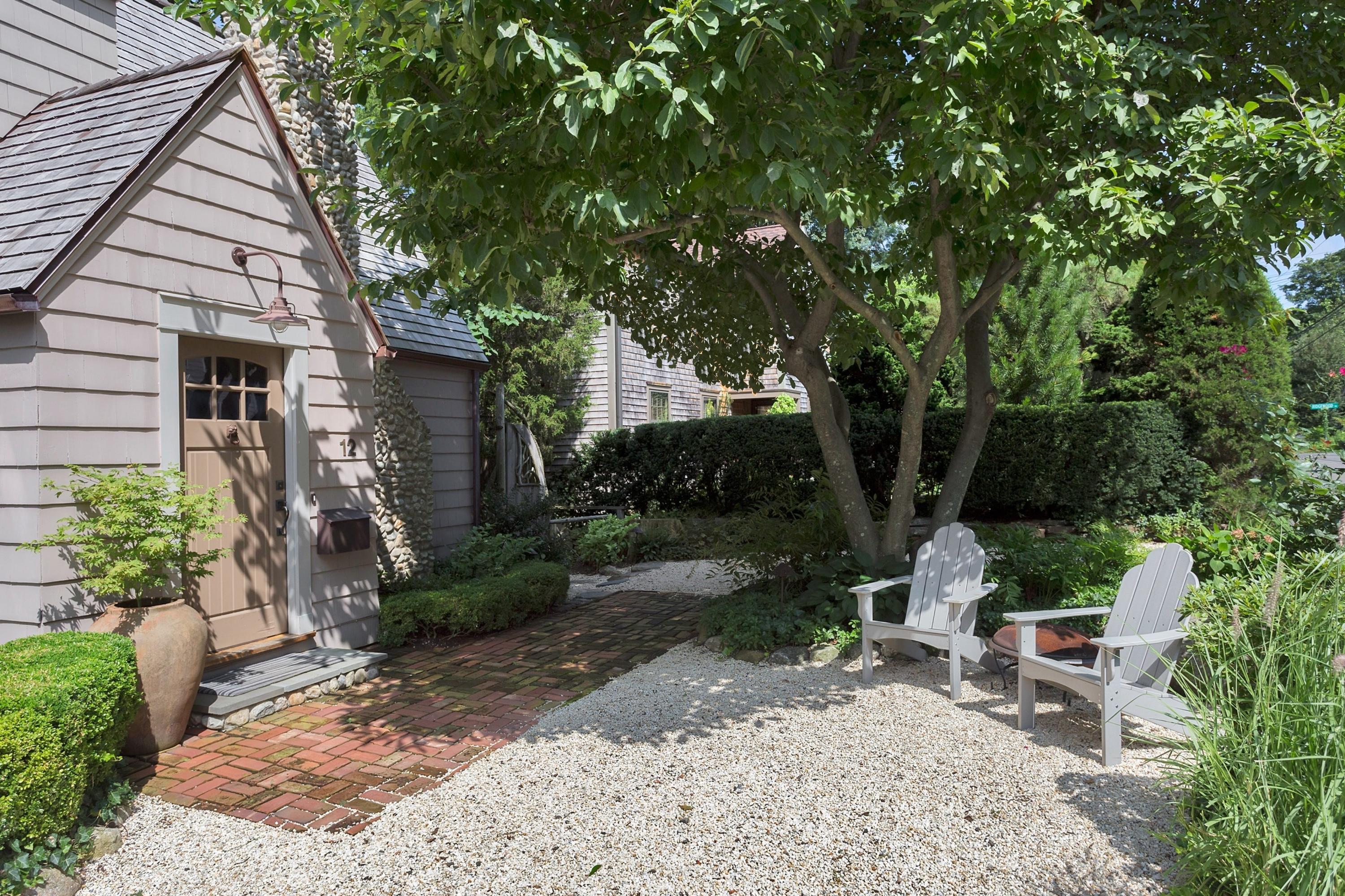 12 Crest Road Rowayton, CT 06853 - Photo 3 of 35 a view of a patio with table and chairs potted plants and large tree