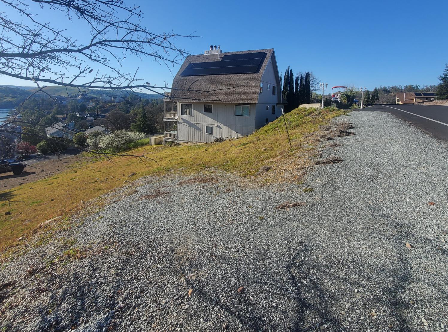 572 Poker Flat Road Copperopolis, CA 95228 - Photo 14 of 31 a bed room with a bed