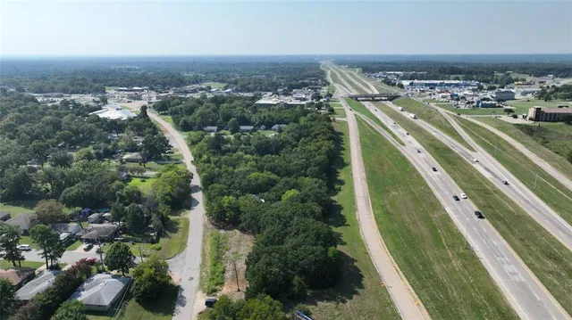 an aerial view of city and lake