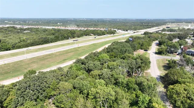 an aerial view of residential houses with city view and lake view