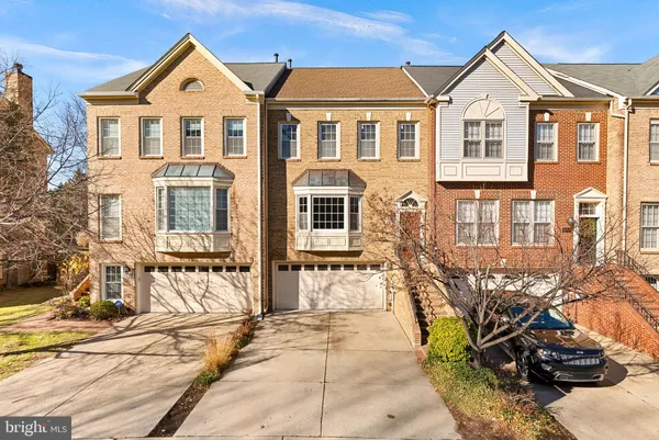 a view of a brick house with many windows