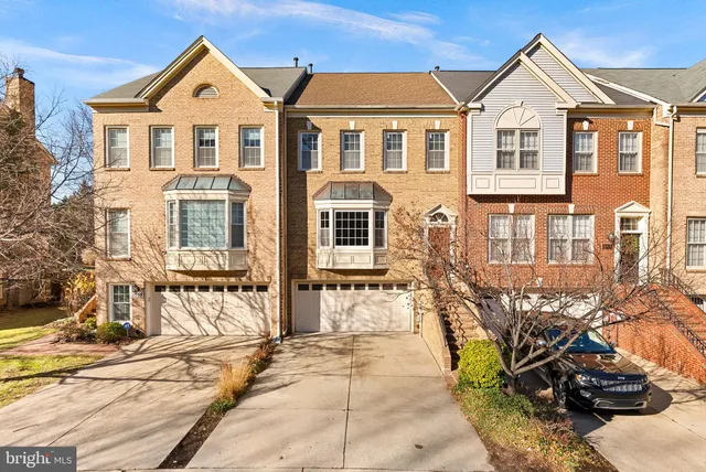 a view of a brick house with many windows