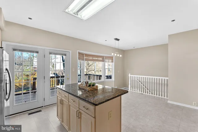 a bedroom with a bed and a large mirror