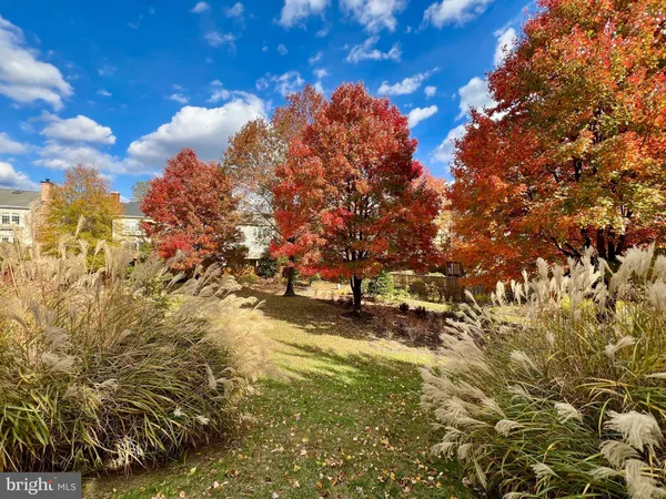 an empty room with large windows and a bathroom