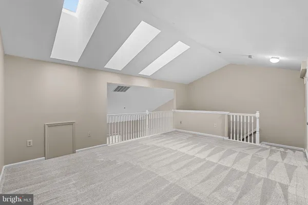 a view of storage and utility room with racks on the wall