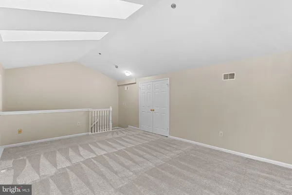 a view of an empty room with a fireplace