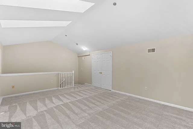 a view of an empty room with a fireplace