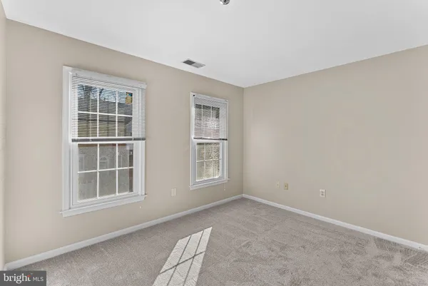 a view of balcony with wooden floor and fence