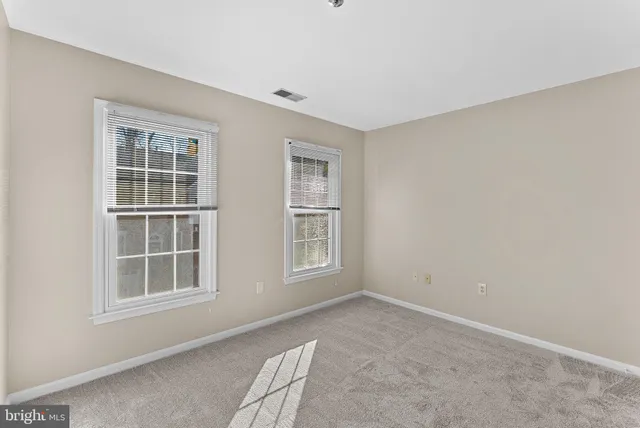 a view of balcony with wooden floor and fence