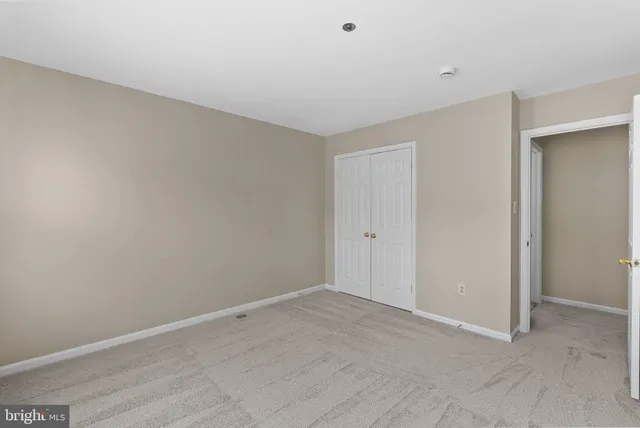 a view of a house with a wooden deck