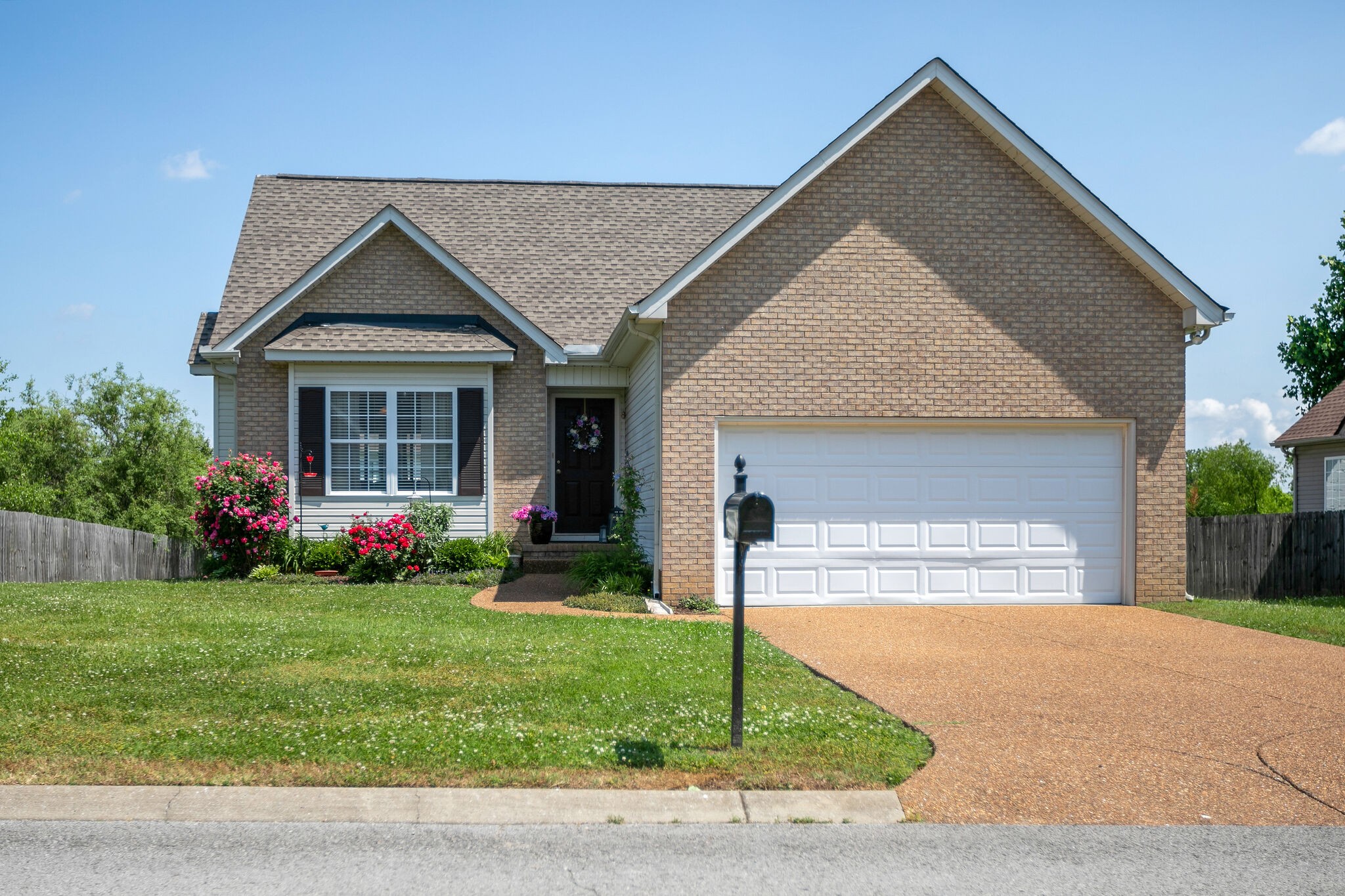 1003 Patterson Street Spring Hill, TN 37174 - Photo 1 of 27 a front view of a house with a yard and garage