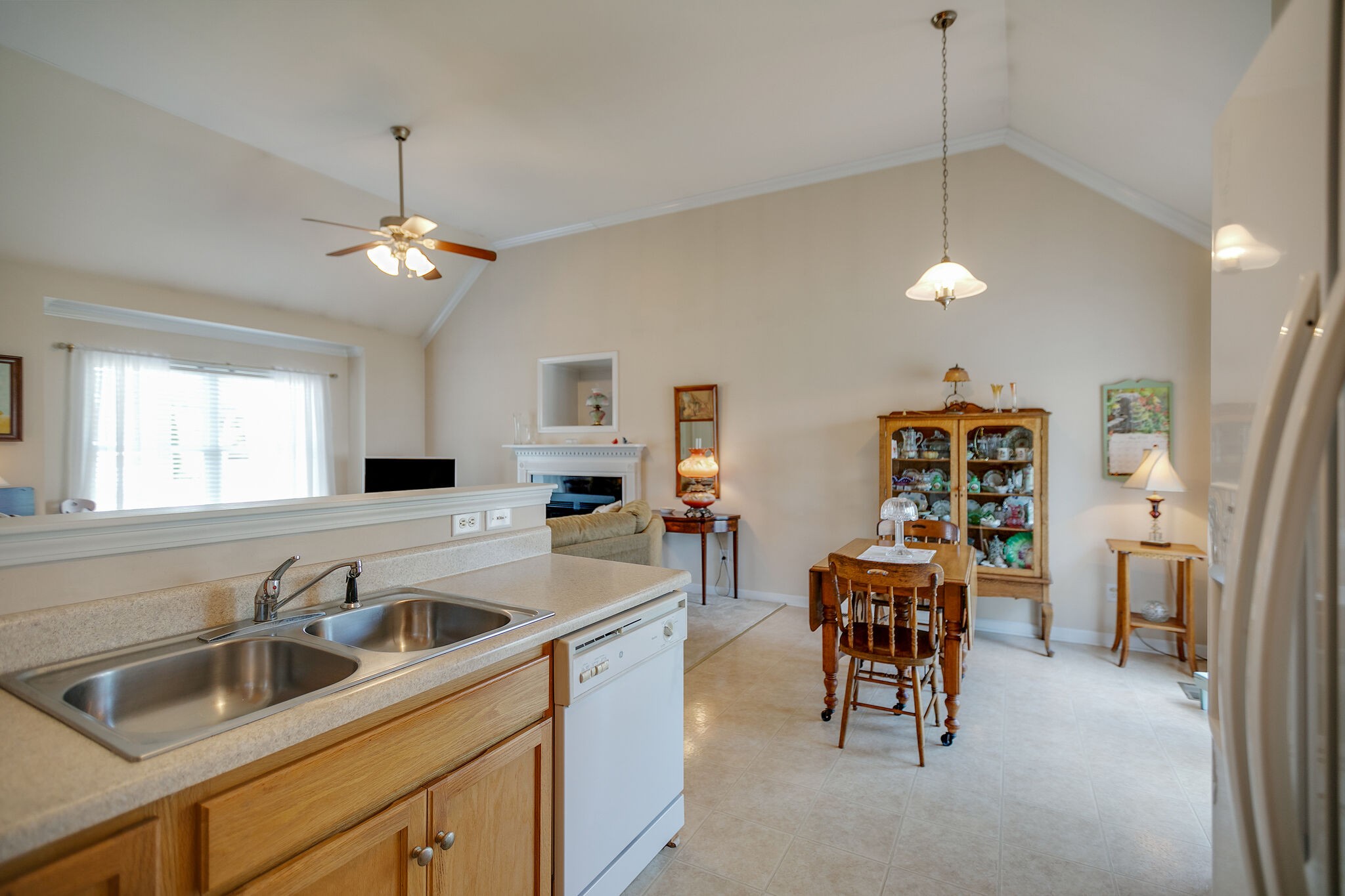 1003 Patterson Street Spring Hill, TN 37174 - Photo 13 of 27 a kitchen with stainless steel appliances granite countertop a sink refrigerator and cabinets