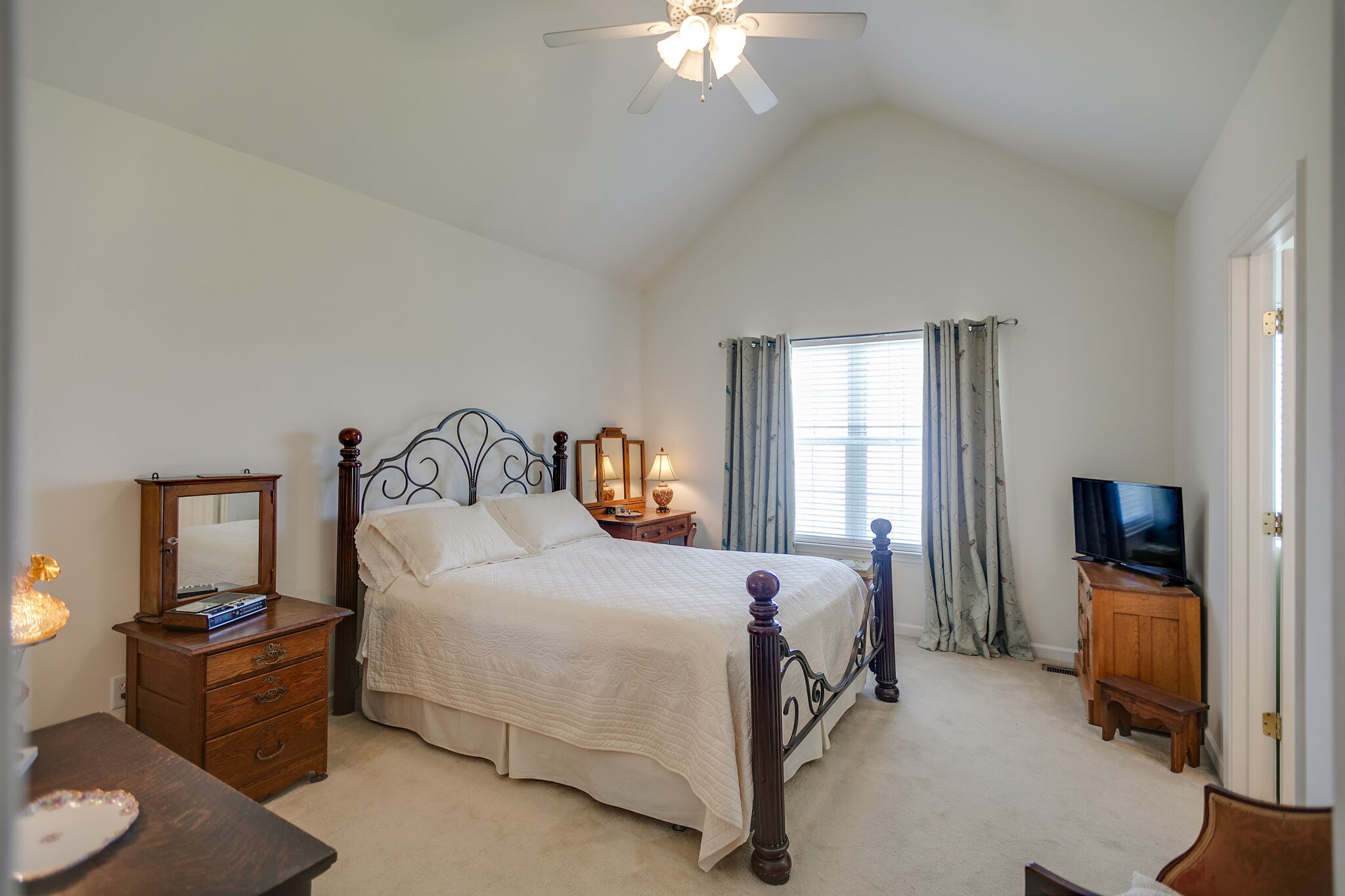 1003 Patterson Street Spring Hill, TN 37174 - Photo 14 of 27 a bedroom with a bed and a chandelier