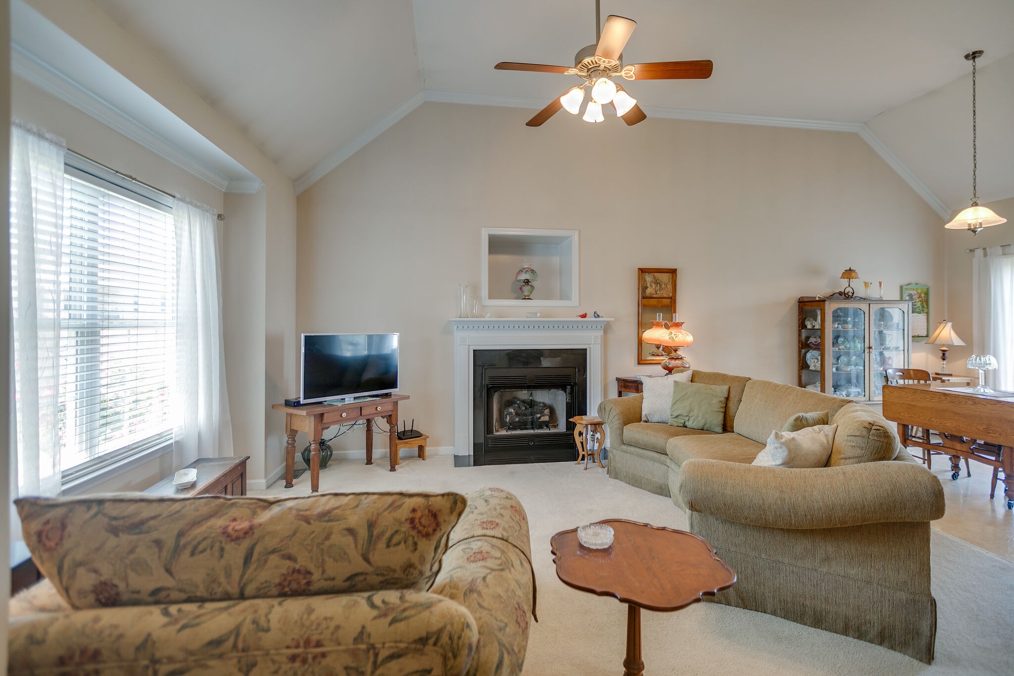 1003 Patterson Street Spring Hill, TN 37174 - Photo 5 of 27 a living room with furniture a fireplace and a large window