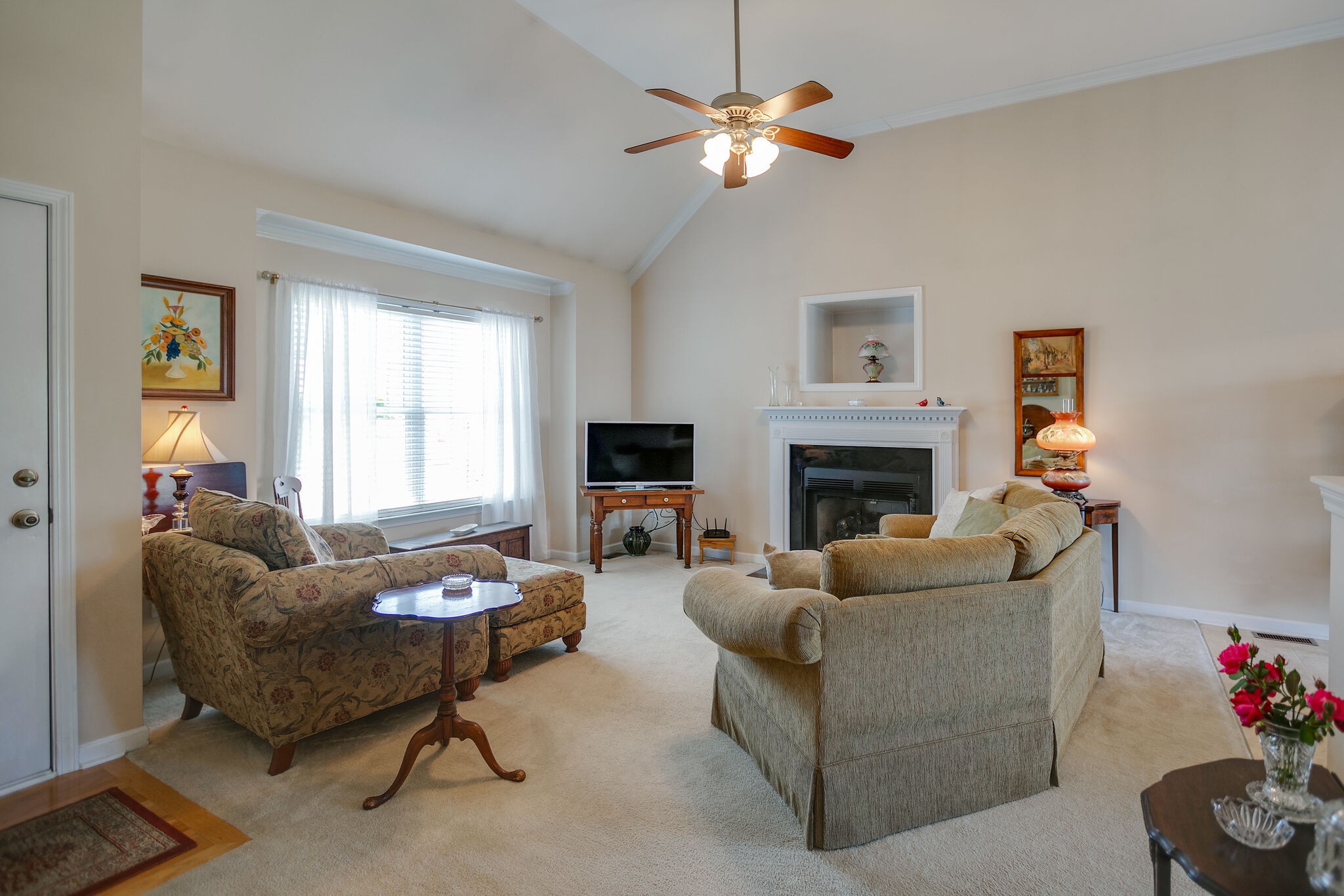 1003 Patterson Street Spring Hill, TN 37174 - Photo 6 of 27 a living room with furniture a fireplace and a window