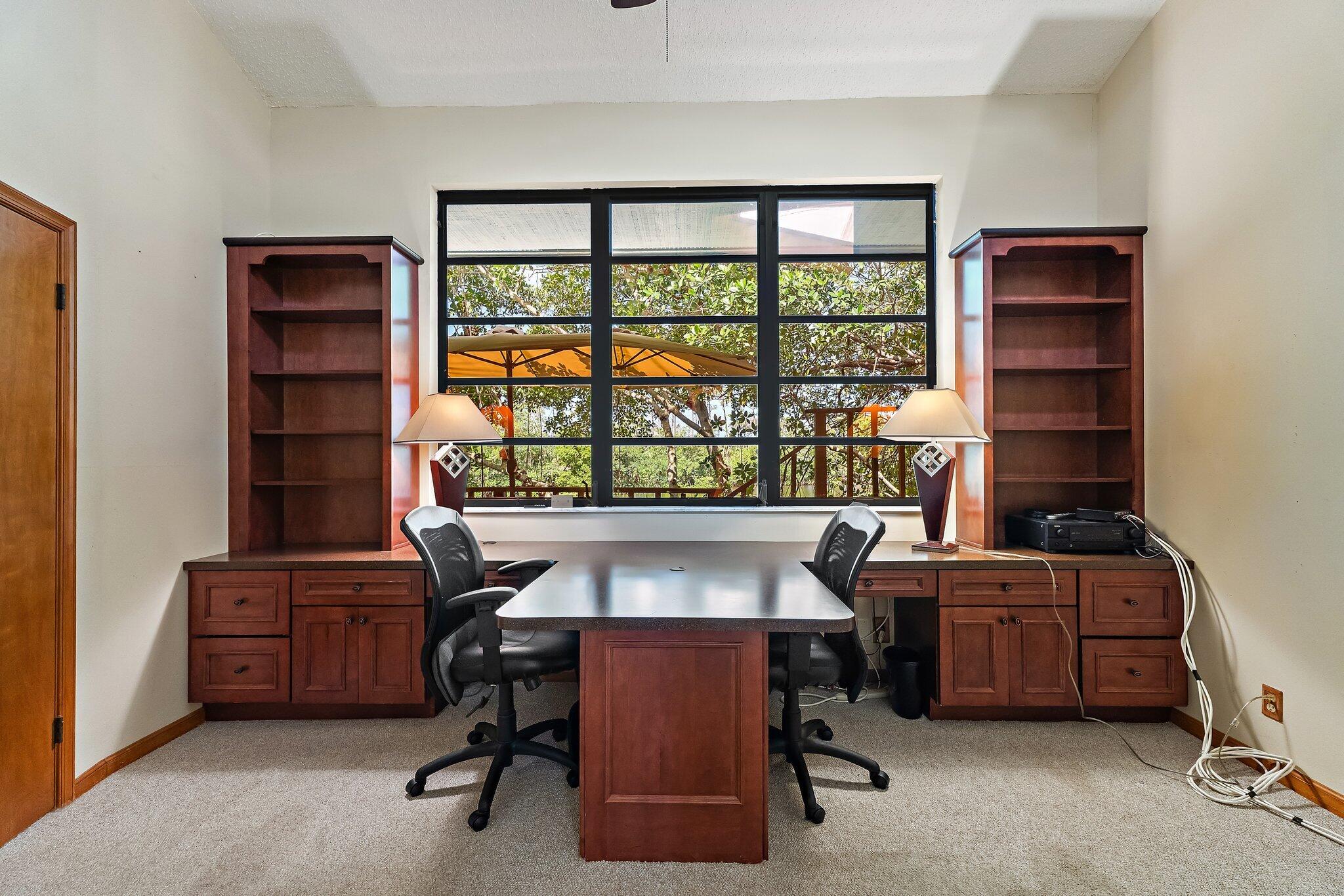 702 Warren Drive Jupiter, FL 33458 - Photo 44 of 76 a view of a workspace with furniture and a window