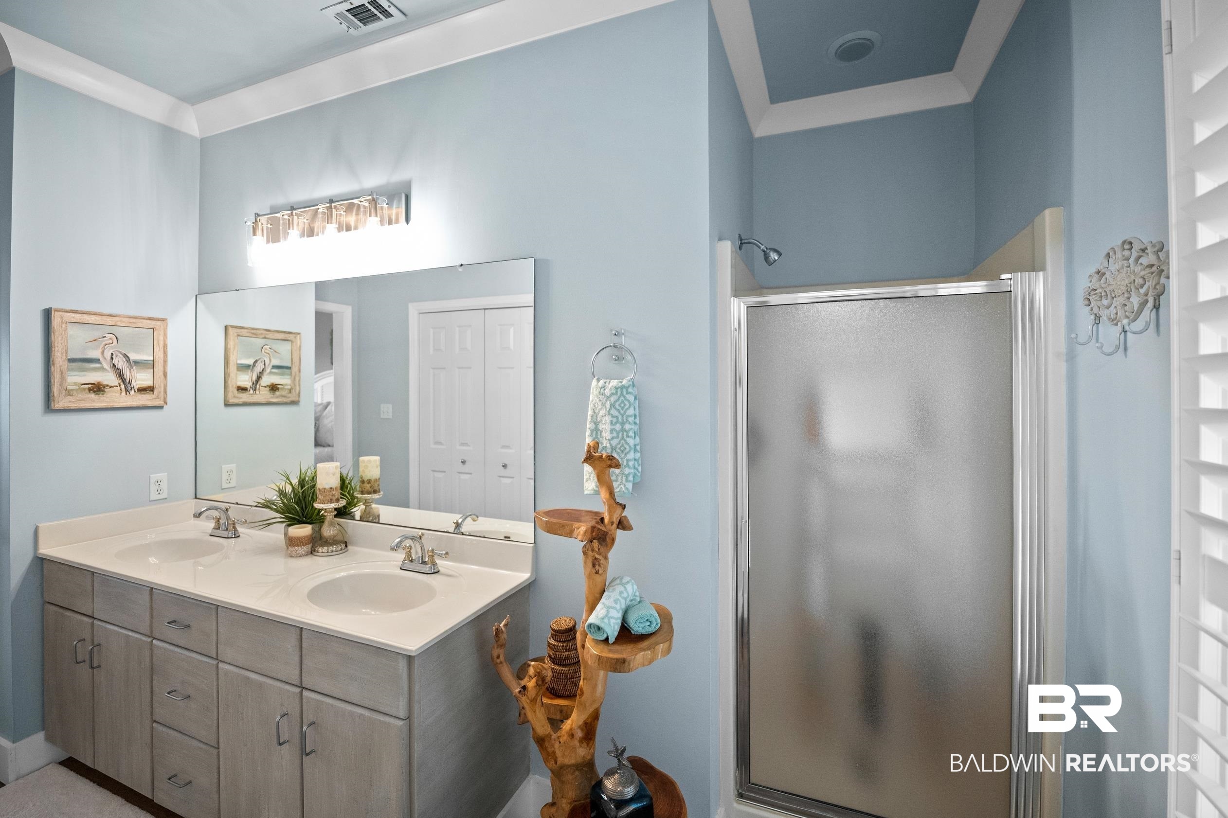 30954 River Road Orange Beach, AL 36561 - Photo 42 of 59 Full bathroom featuring a stall shower and double vanity