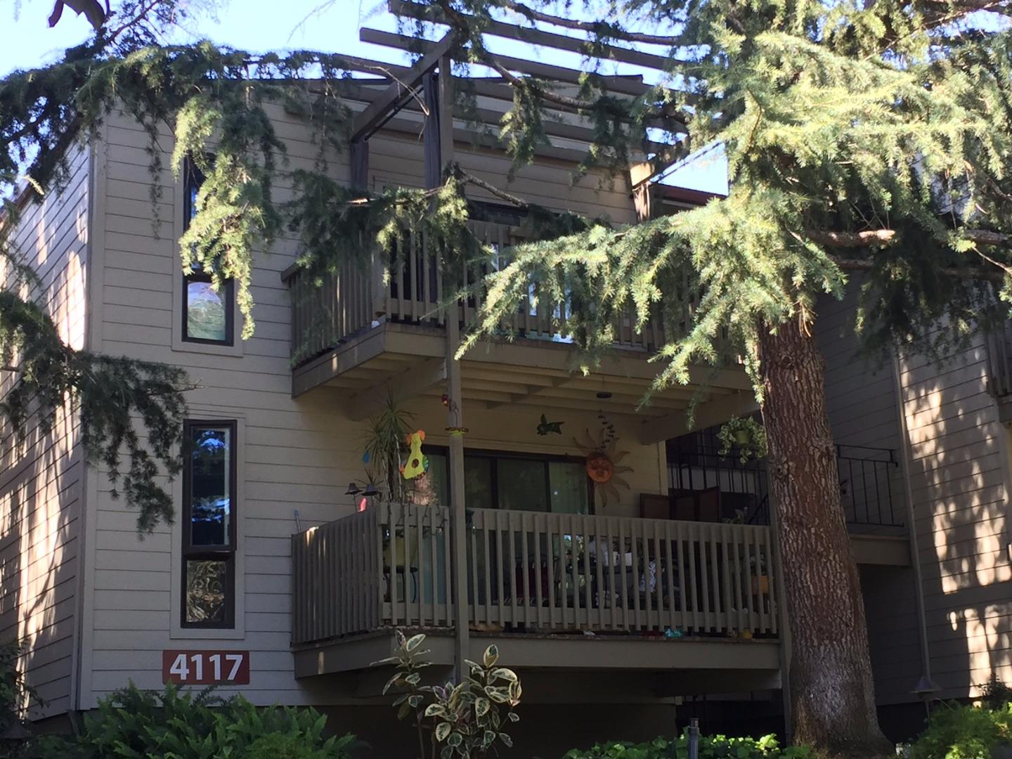 a view of a house with a tree