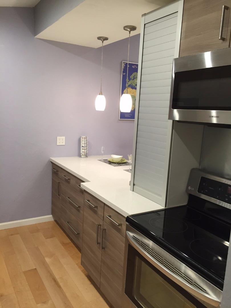 4117 George Avenue, Unit 4 San Mateo, CA 94403 - Photo 11 of 18 a bathroom with a sink and a mirror