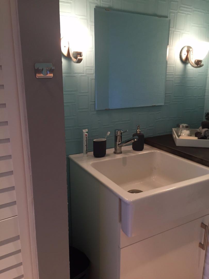 4117 George Avenue, Unit 4 San Mateo, CA 94403 - Photo 16 of 18 a bathroom with a sink and a mirror