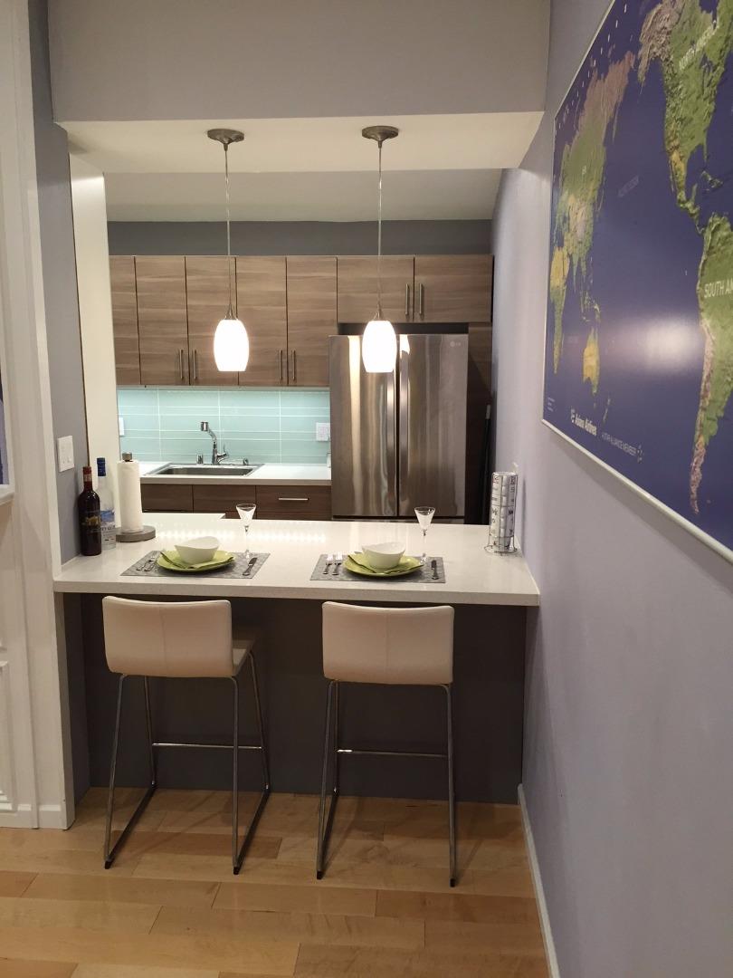 4117 George Avenue, Unit 4 San Mateo, CA 94403 - Photo 7 of 18 a bathroom with a sink and a mirror