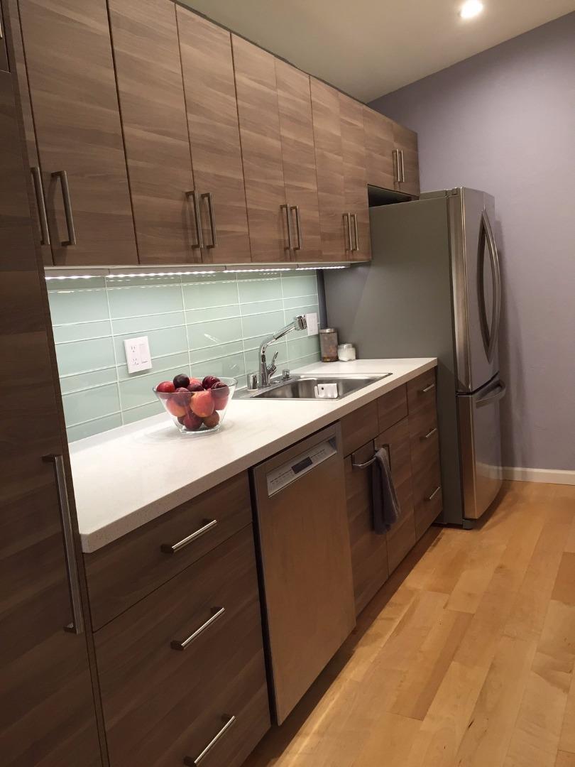 4117 George Avenue, Unit 4 San Mateo, CA 94403 - Photo 9 of 18 a kitchen with stainless steel appliances a sink dishwasher stove and refrigerator