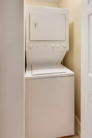 a view of a balcony with a large window and wooden floor