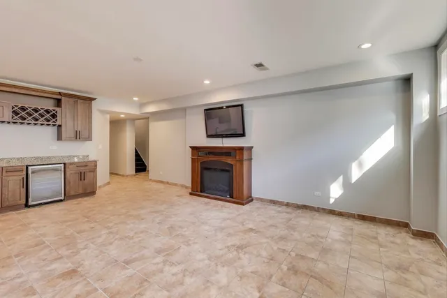 a view of empty room with a fireplace