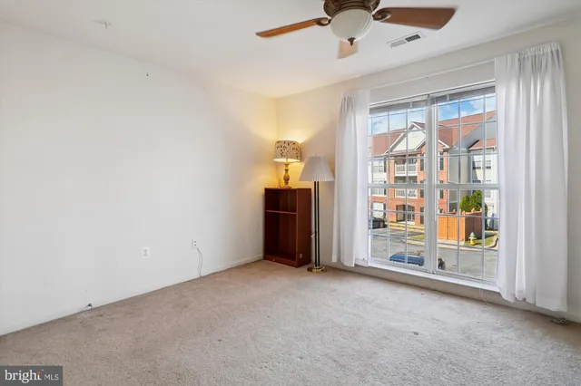 a kitchen with granite countertop cabinets sink and window