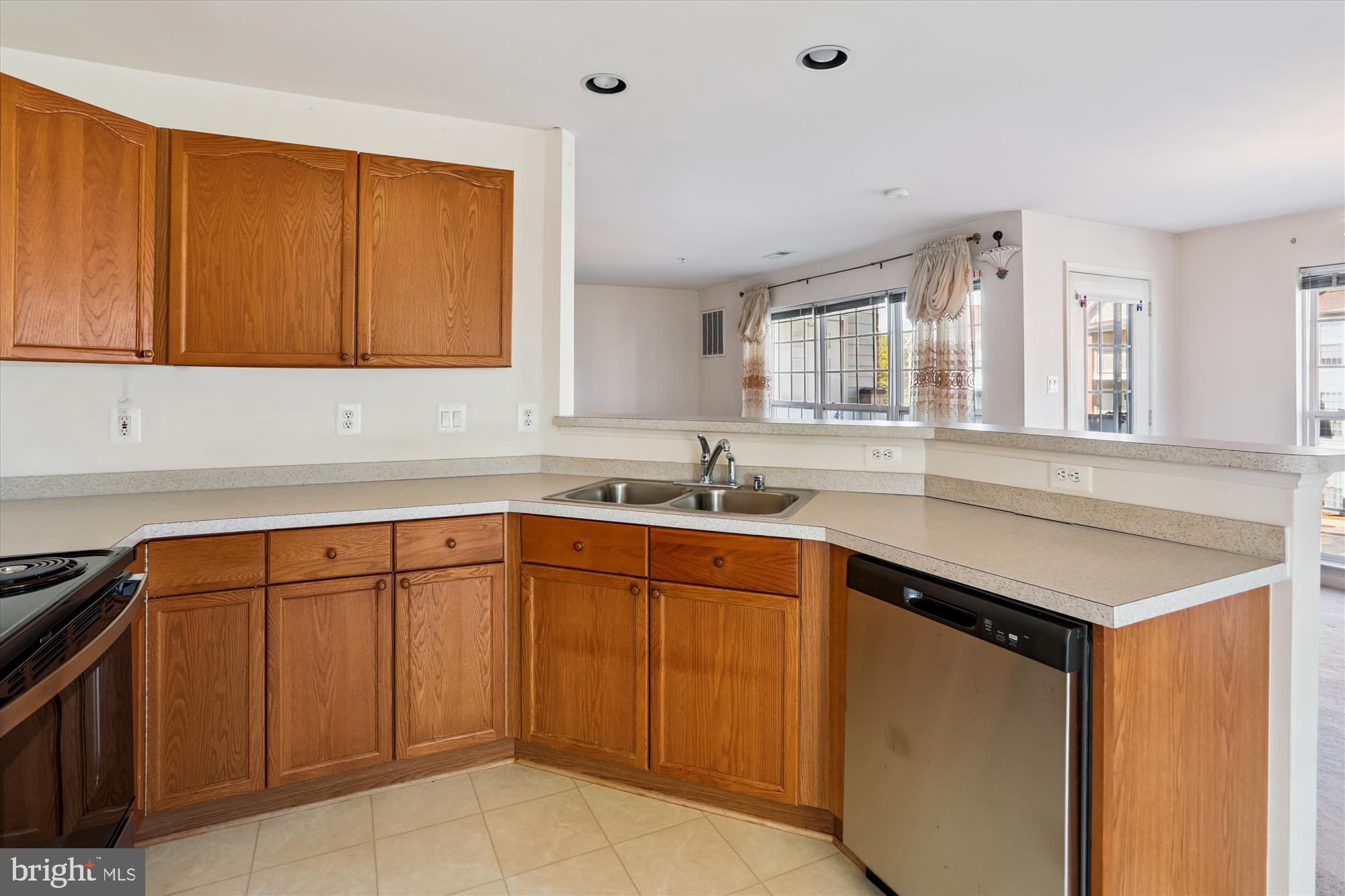 2500 Coleridge Drive, Unit 2A Frederick, MD 21702 - Photo 15 of 60 a kitchen with granite countertop cabinets sink and window