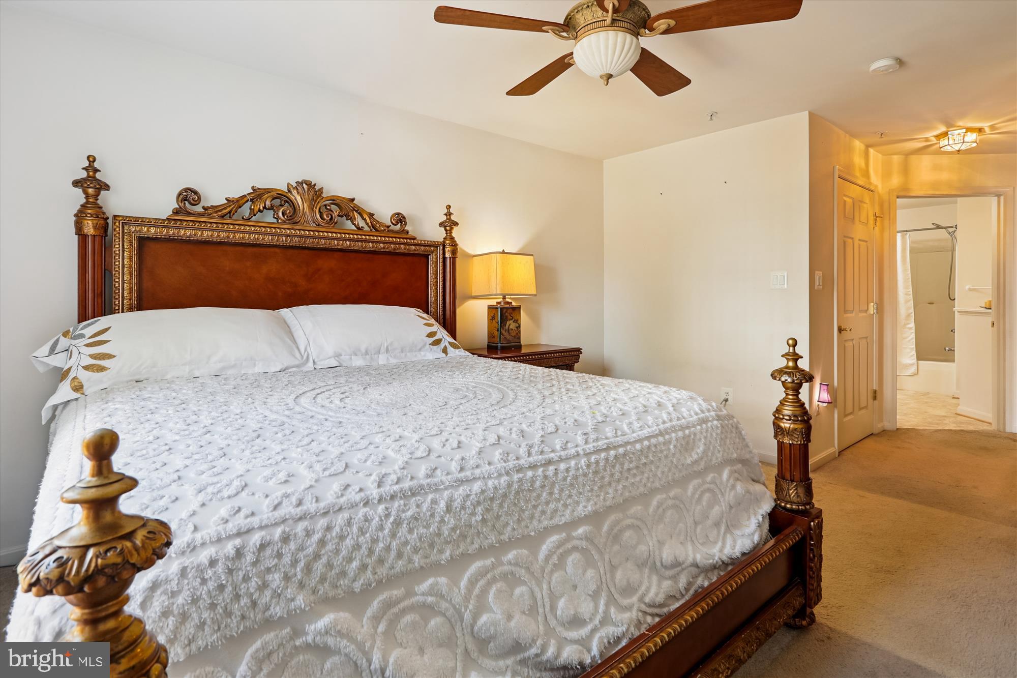 2500 Coleridge Drive, Unit 2A Frederick, MD 21702 - Photo 18 of 60 a bedroom with a bed and a chandelier