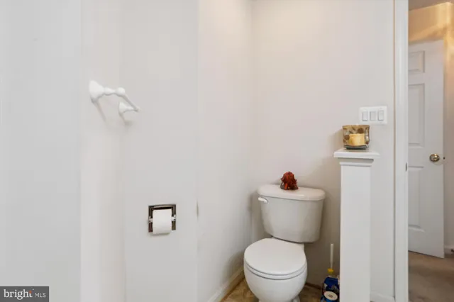 a view of a house with sitting area and potted plants