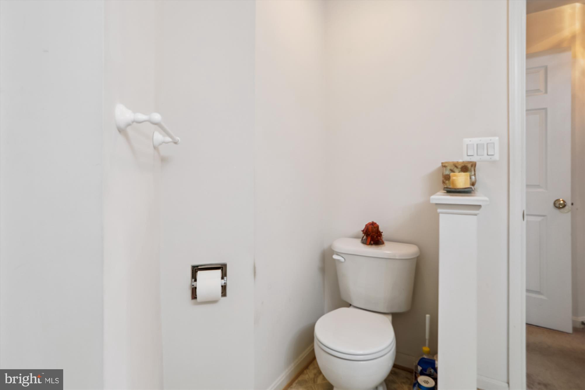 2500 Coleridge Drive, Unit 2A Frederick, MD 21702 - Photo 29 of 60 a white toilet sitting next to a bathroom sink