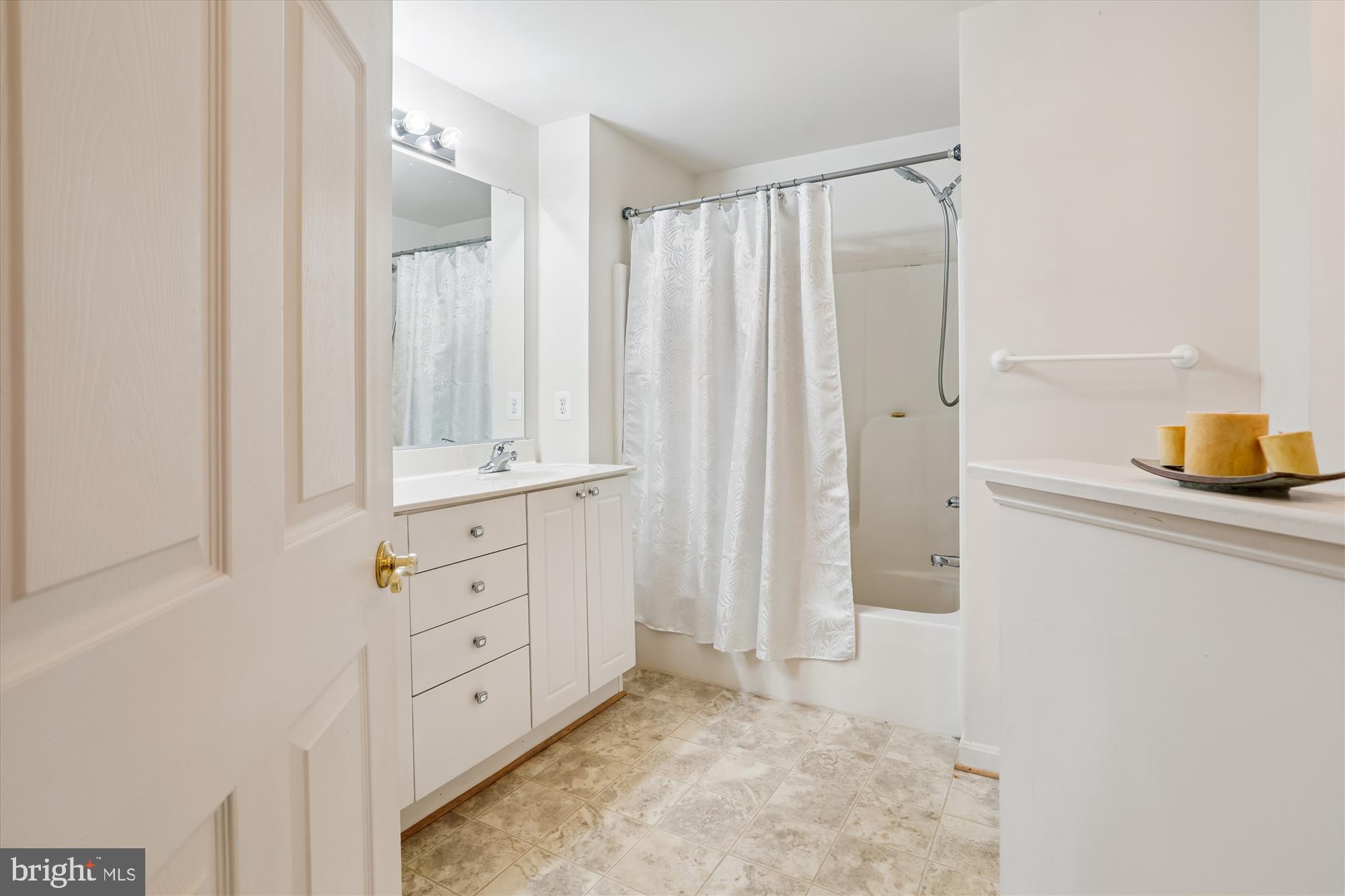 2500 Coleridge Drive, Unit 2A Frederick, MD 21702 - Photo 31 of 60 a bathroom with a granite countertop sink and a mirror