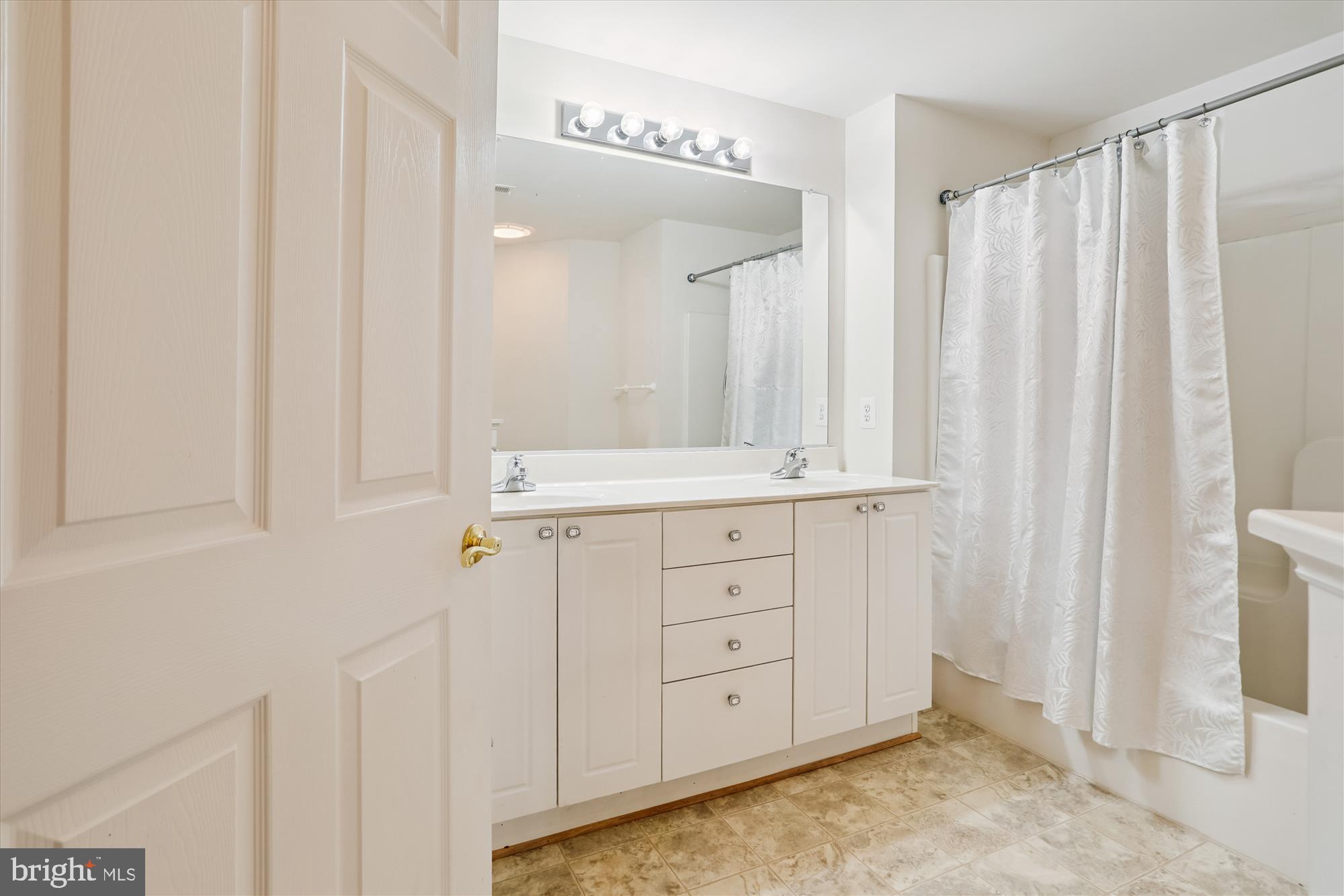 2500 Coleridge Drive, Unit 2A Frederick, MD 21702 - Photo 32 of 60 a bathroom with a sink and a mirror
