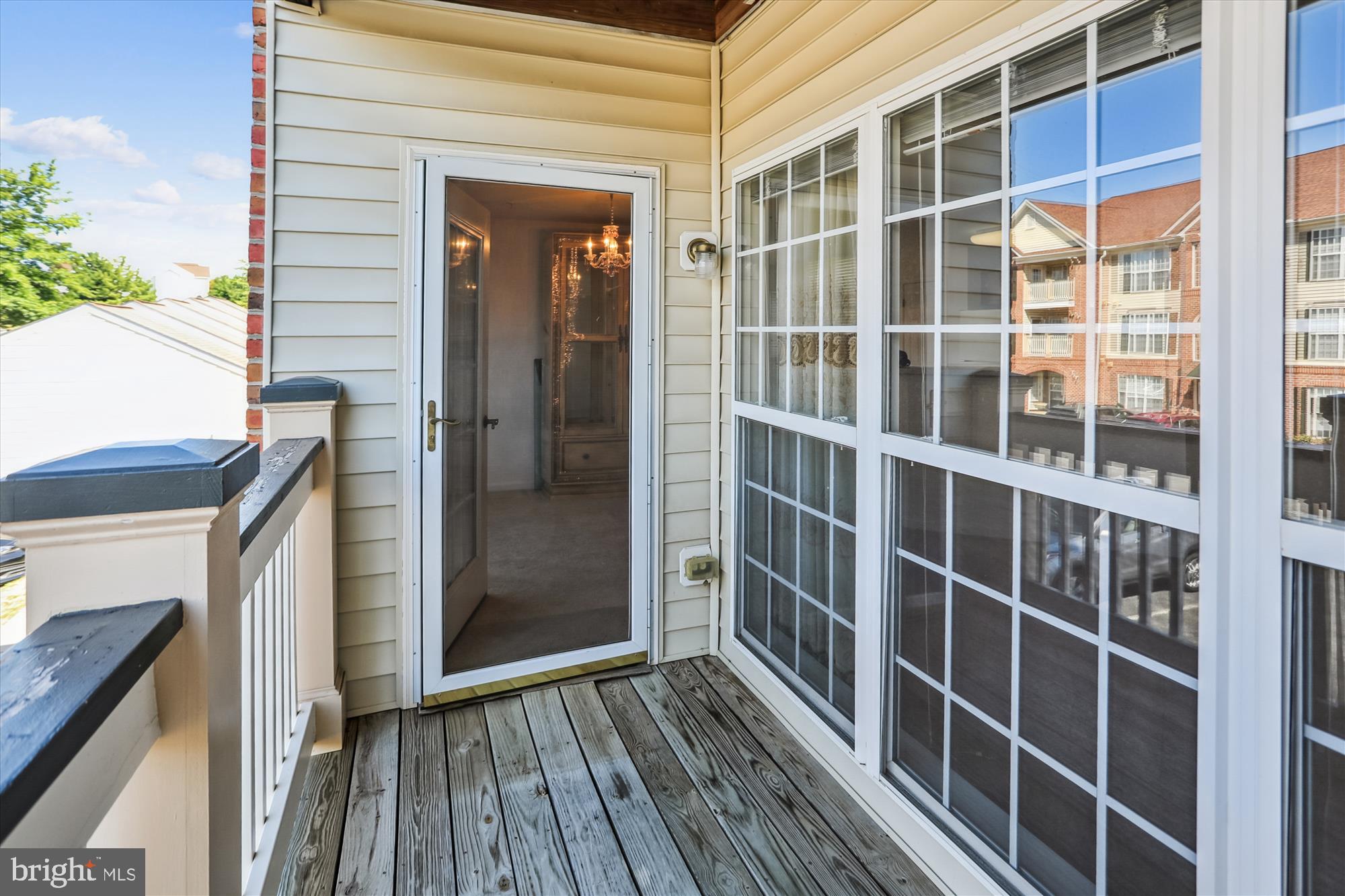 2500 Coleridge Drive, Unit 2A Frederick, MD 21702 - Photo 34 of 60 a view of a balcony with wooden floor and fence