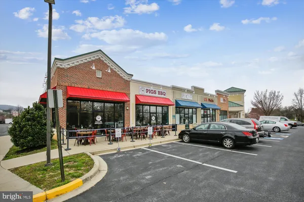 a view of swimming pool with outdoor seating and a patio