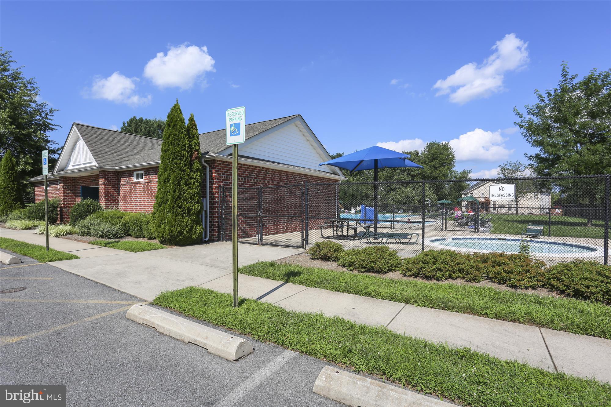 2500 Coleridge Drive, Unit 2A Frederick, MD 21702 - Photo 49 of 60 a front view of a house with a yard and a garage